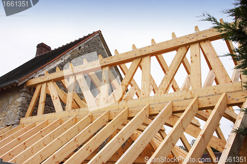 Image of construction of the wooden frame of a roof