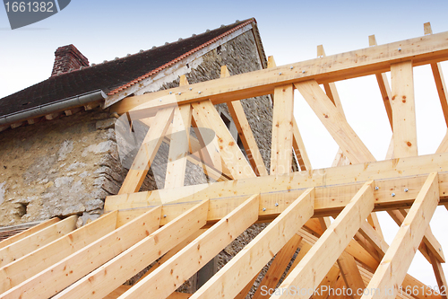 Image of construction of the wooden frame of a roof