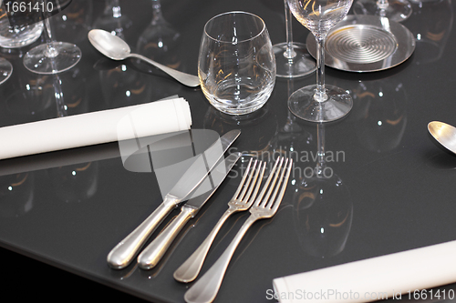 Image of glasses, cutlery on the table a great restaurant