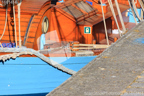 Image of details of an old fishing boat sailing out of wood