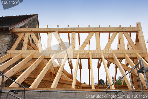 Image of construction of the wooden frame of a roof