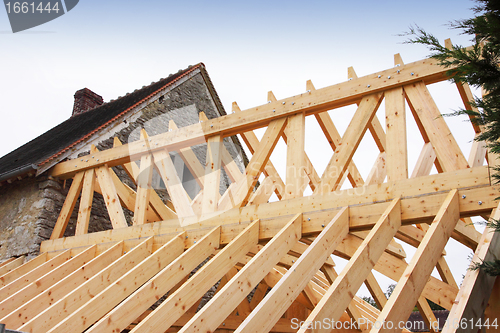 Image of construction of the wooden frame of a roof