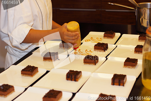 Image of preparation of dessert plates for a chocolate cake louis XV
