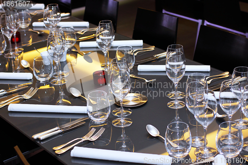 Image of glasses, cutlery on the table a great restaurant