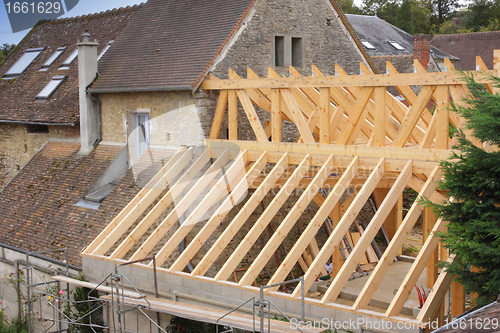 Image of construction of the wooden frame of a roof