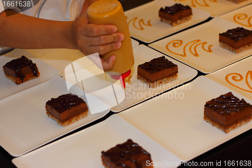 Image of preparation of dessert plates for a chocolate cake louis XV