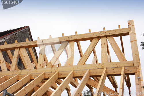 Image of construction of the wooden frame of a roof