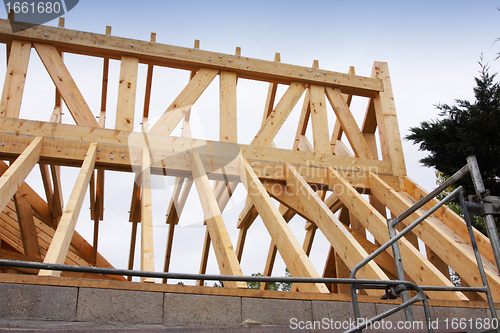 Image of construction of the wooden frame of a roof