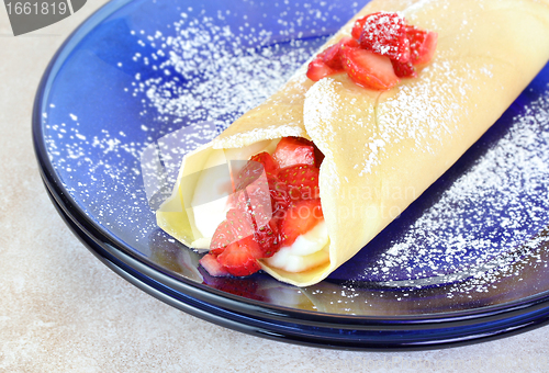 Image of Delicious Strawberry and Cheese Crepe garnished with confectione