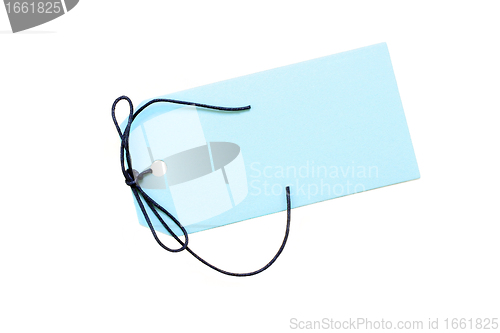 Image of Blank blue tag with dark blue cord on white with copy space.