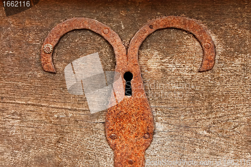 Image of Detail of old chest with rusty iron plate