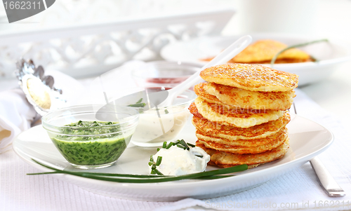 Image of Potato pancakes with three dips