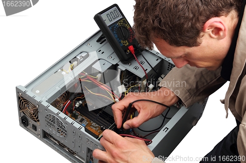 Image of Professinal repairing a PC