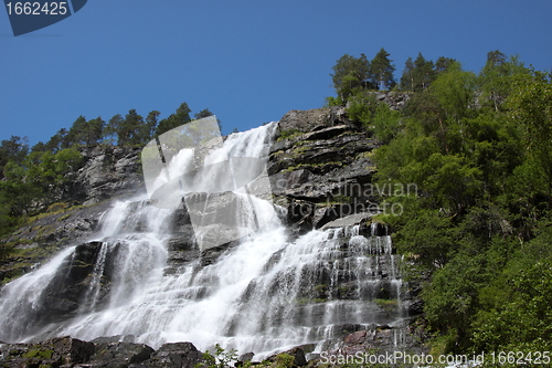 Image of Big waterfall in a fjord it norvege in spring