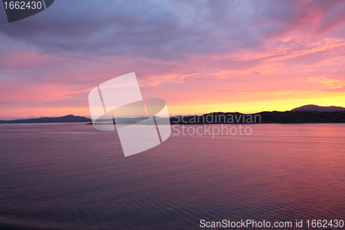 Image of sunset view from a boat off the coast of norway