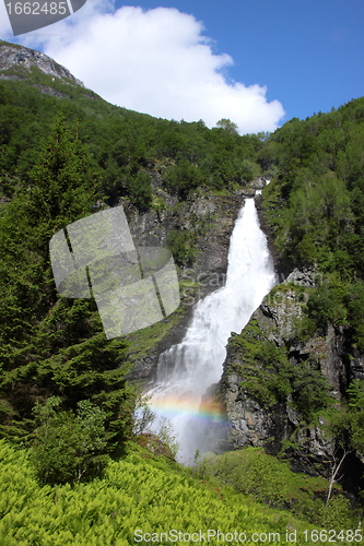 Image of Big waterfall in a fjord it norvege in spring