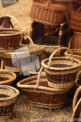 Image of Details of the manufacturing of wicker baskets by a man