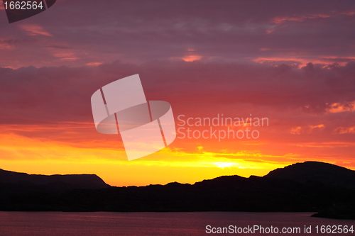 Image of sunset view from a boat off the coast of norway