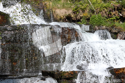 Image of Big waterfall in a fjord it norvege in spring