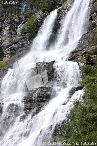 Image of Big waterfall in a fjord it norvege in spring