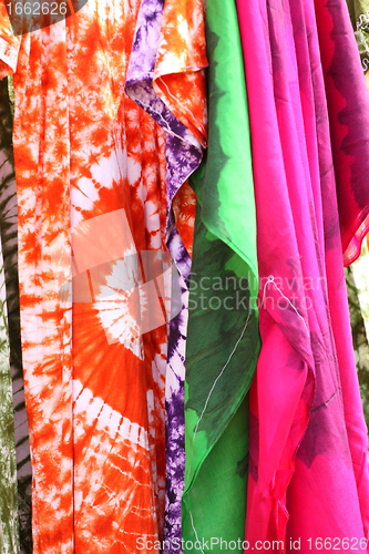 Image of African dresses colored on a market for the sale