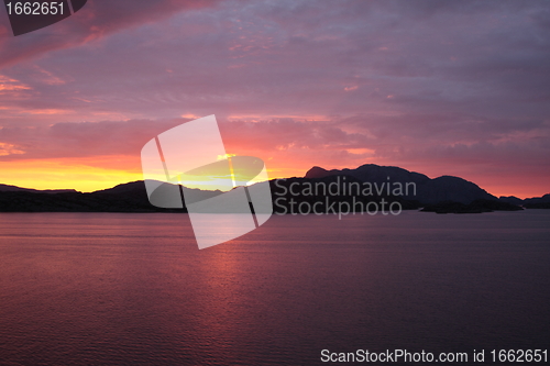 Image of sunset view from a boat off the coast of norway