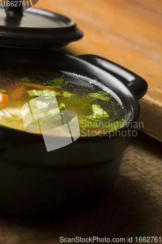 Image of Chicken soup in the ceramic bowl 