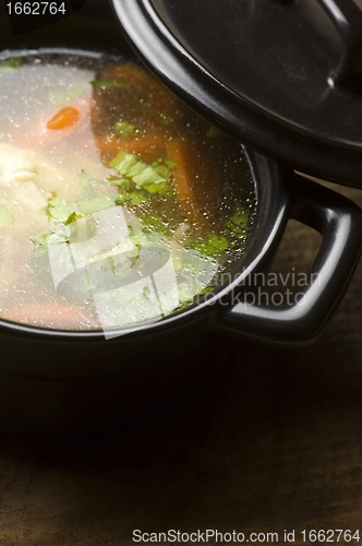 Image of Chicken soup in the ceramic bowl 