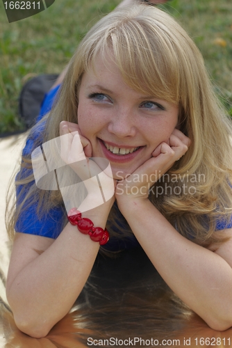 Image of Woman lying on grass
