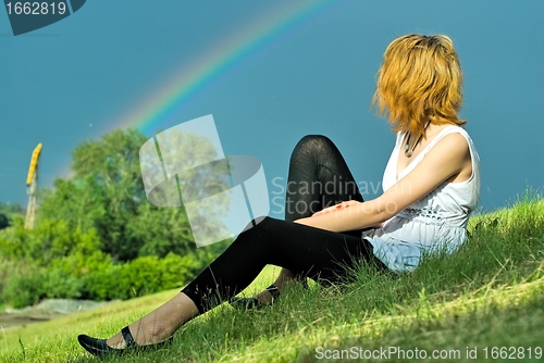 Image of Attractive girl and rainbow