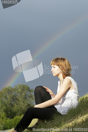 Image of Attractive girl and rainbow