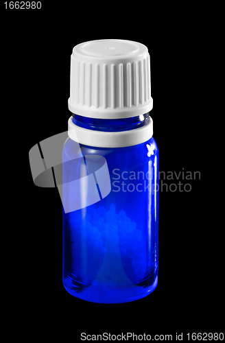 Image of small bottle with globules