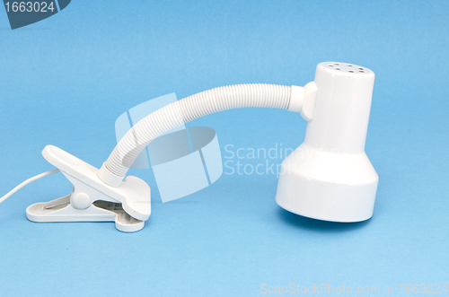 Image of white desk lamp attachable object isolated on blue 