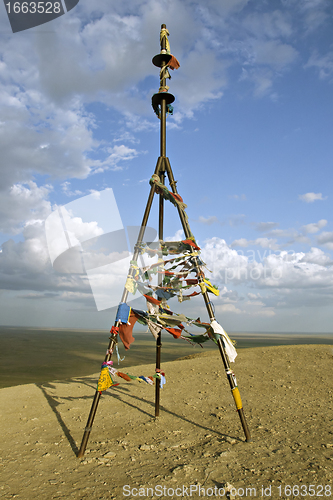 Image of Triangulation mark with buddhist prayer flags