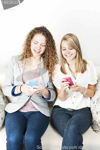 Image of Two women using mobile devices