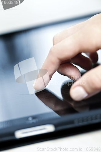 Image of Tablet computer with hand