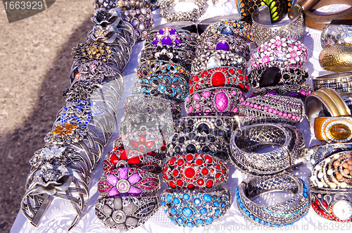 Image of handmade jewelry bracelets head ring outdoor fair 