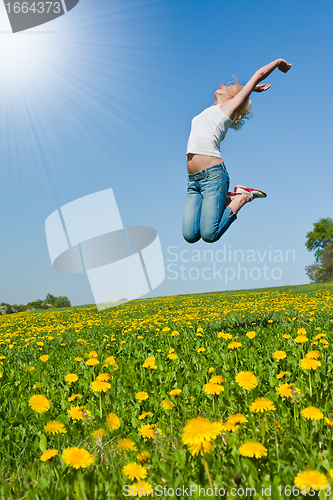 Image of happy young woman on meadow