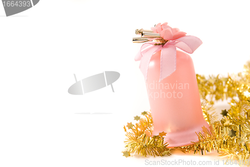 Image of golden tinsel with pink glass decoration