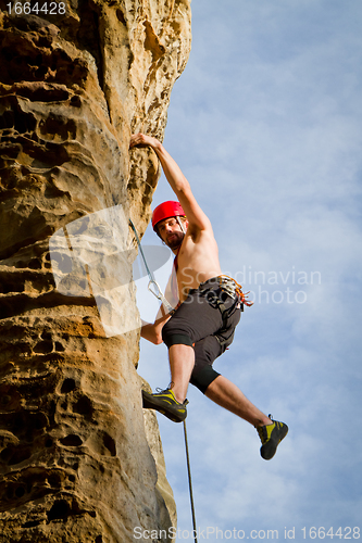 Image of male rock climber