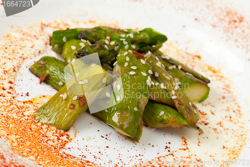 Image of Fried Asparagus on white plate