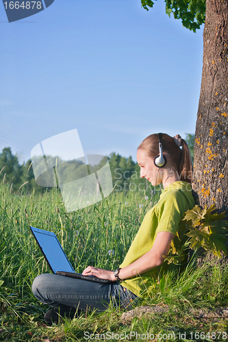 Image of Girl with laptop in the country