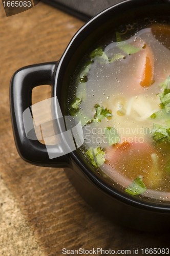 Image of Chicken soup in the ceramic bowl 