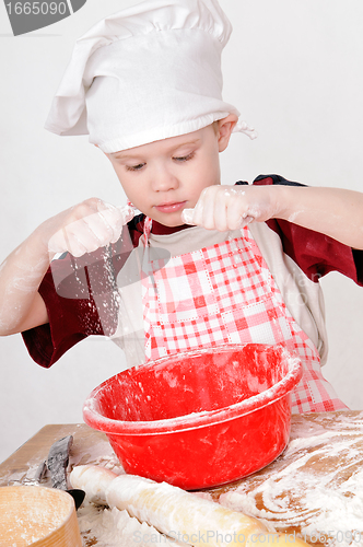Image of boy with flour