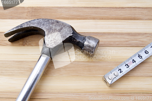 Image of Old hammer and tape measure 