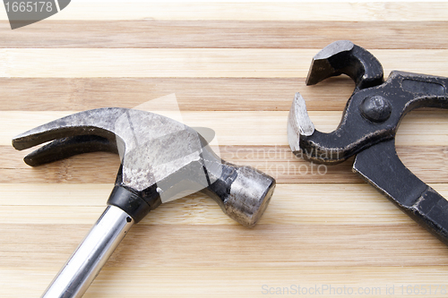 Image of Old wrench and hammer