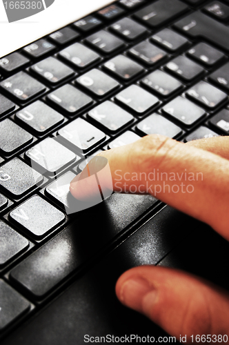 Image of Typing on laptop