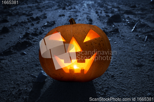 Image of Halloween glowing pumpkin at night