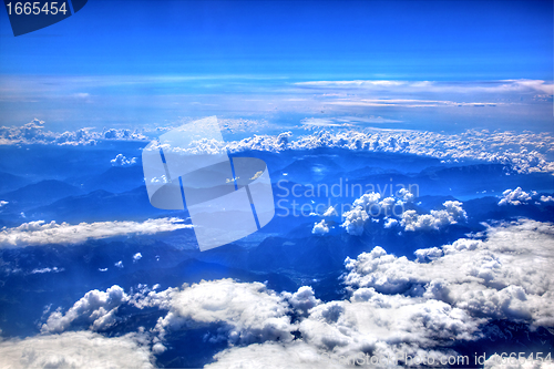 Image of High in the sky, puffy white clouds