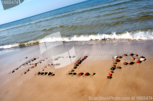 Image of Word HELP on beach sand